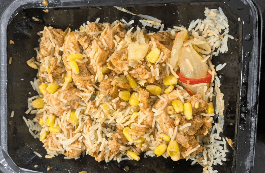 A heated serving of chicken, rice, and corn from Forkful