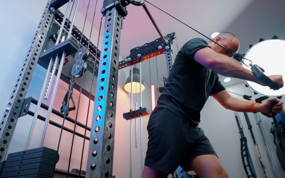 Profile view of Coop using cables on a Titan Fitness Functional Trainer