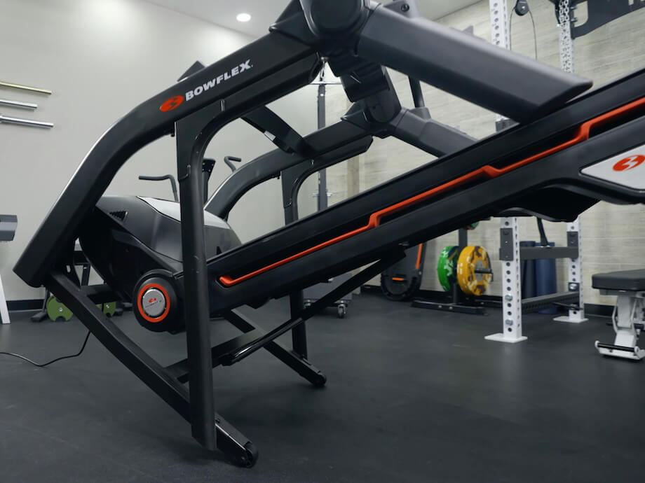 Product tester moving the Bowflex Treadmill 10 using the built-in transport wheels