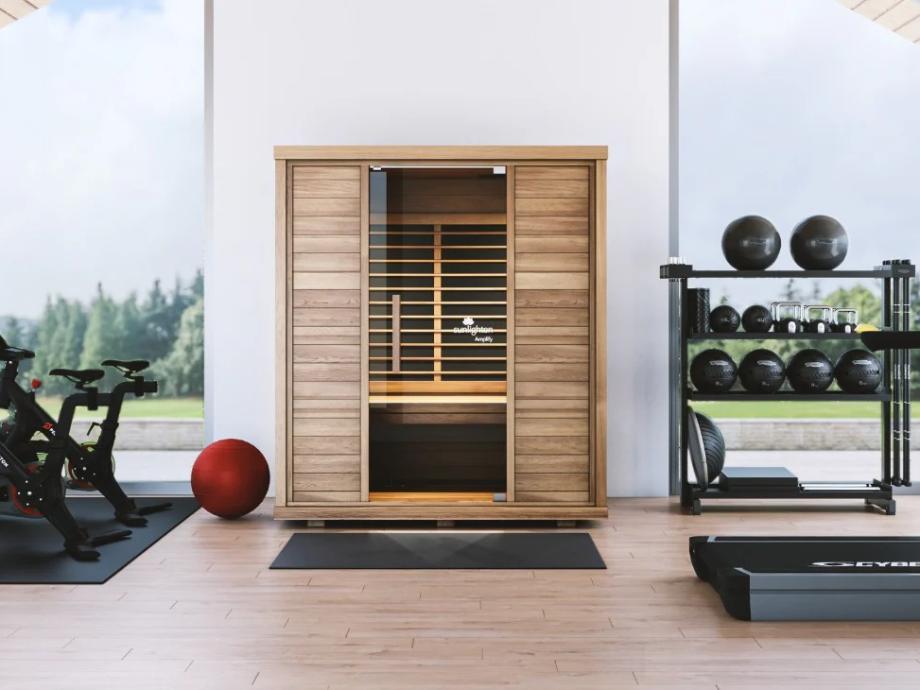 A Sunlighten Amplify II Sauna is shown in a gym setting