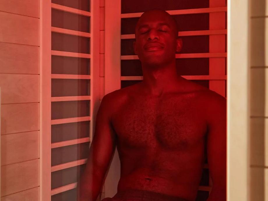 A person sitting in the Sunlighten Amplify II