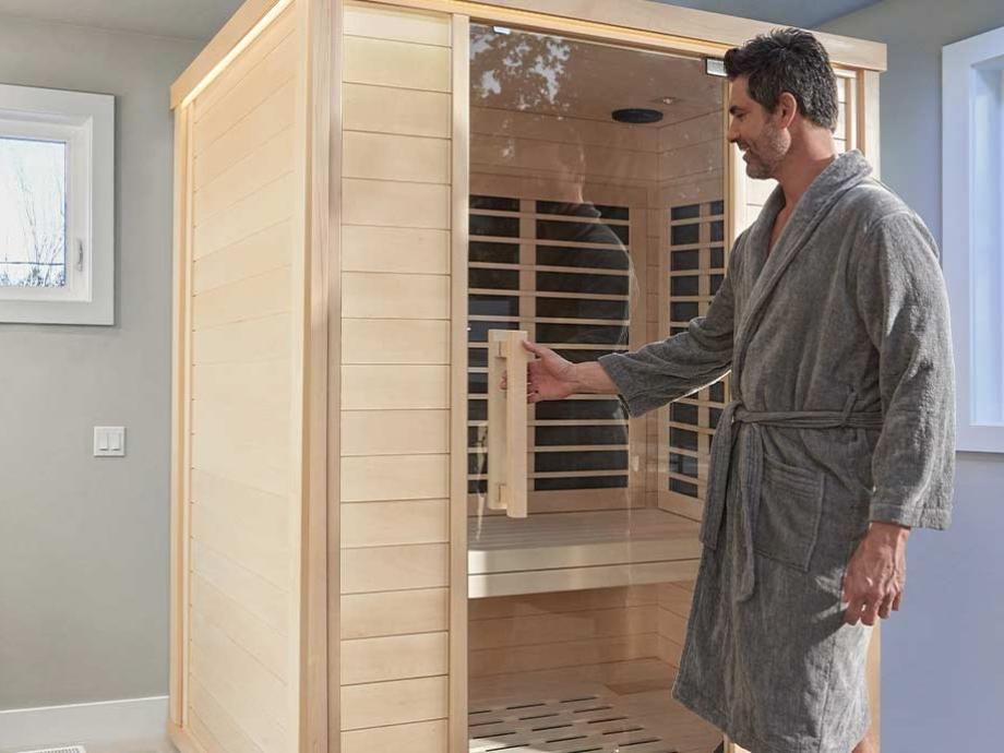 A person walks into the Amplify II infrared sauna