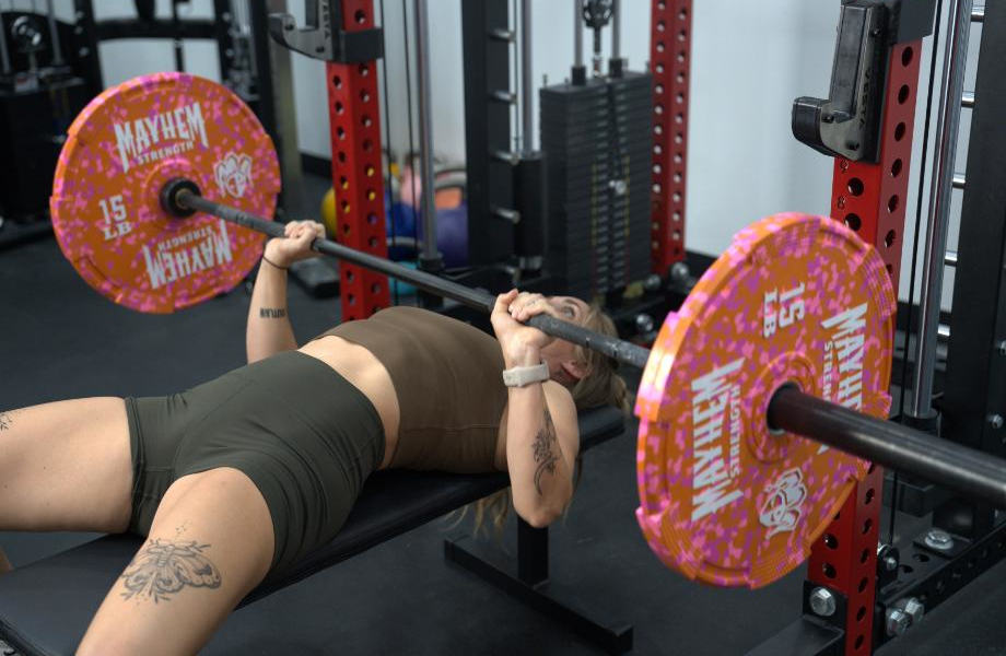 Woman benching with a Fringe Sport Wonder Bar