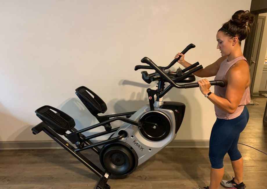 A woman moving the Bowflex Max Trainer M6