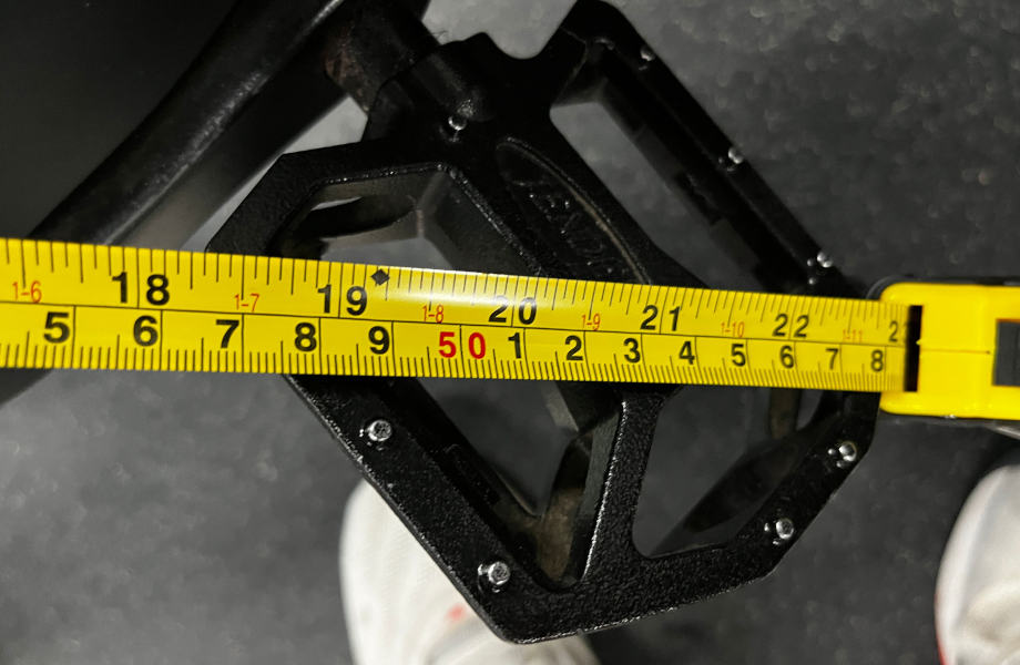 Our tester measures the pedal length on a Concept2 BikeErg