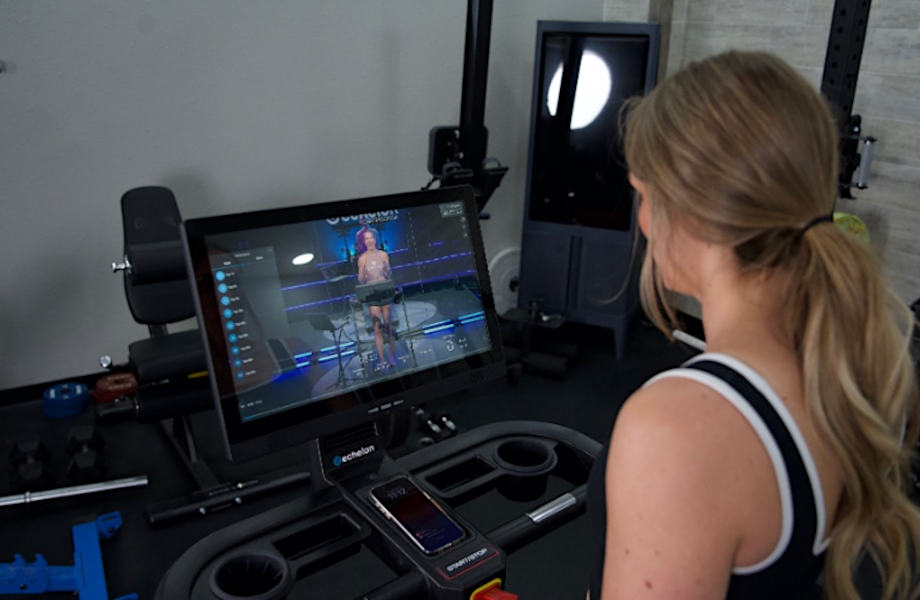 Woman following along with Echelon programming on the Stride 8s treadmill
