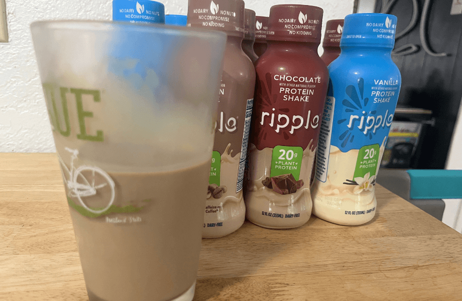 Our tester showcasing their roster of Ripple Vegan Protein Shake servings