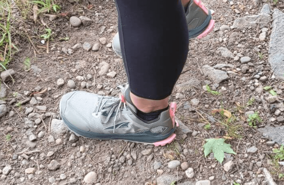 Our tester navigating down a pathway in their Altra Lone Peak 9 trail running shoes