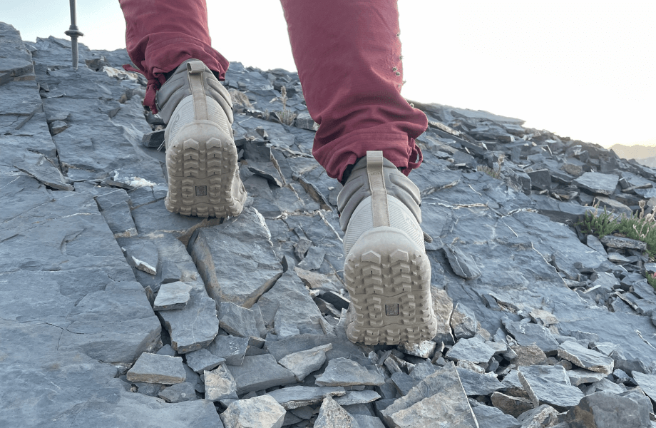 Our tester climbing some rocky terrain in their Xero Shoes Scrambler Trails
