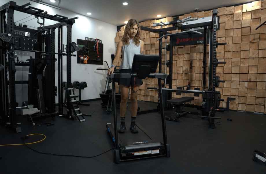 Our tester dialing in their settings for a workout on the MERACH T12 Foldable Walking Treadmill