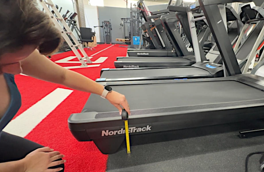 Our tester measuring the step-up height of treadmills in our testing facility.