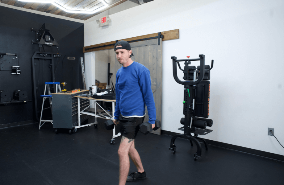 Our tester getting ready for a set of dumbbell lunges with Iron Bull Rubber Hex Dumbbells