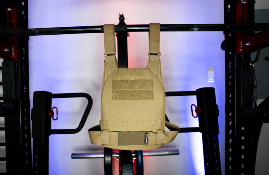 The Rogue Fitness Plate Carrier hanging on a barbell