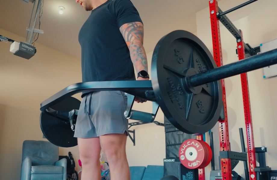 Our tester performing trap bar deadlifts with a set of The Strength Co. Olympic Iron Barbell Plates