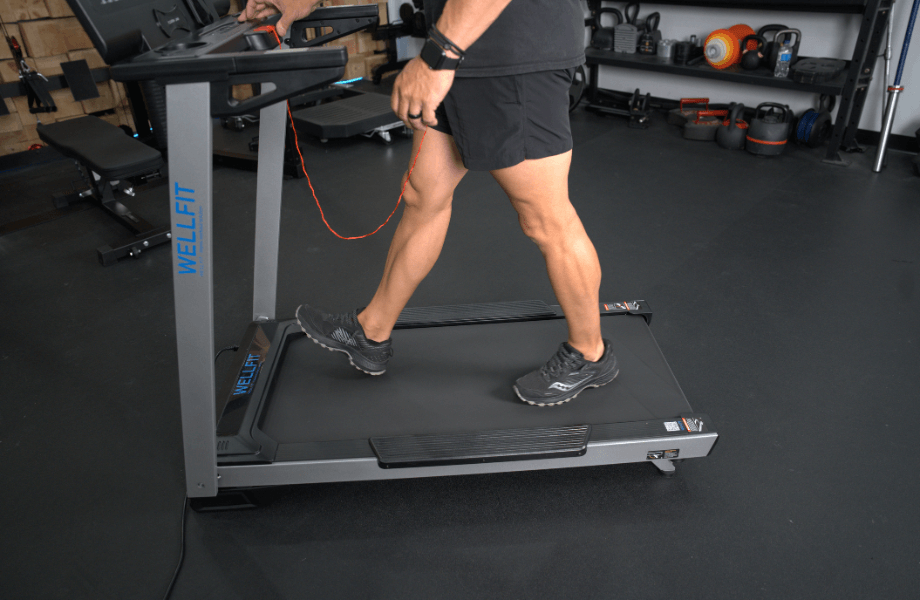 Our tester walking on the Wellfit TM024 Treadmill