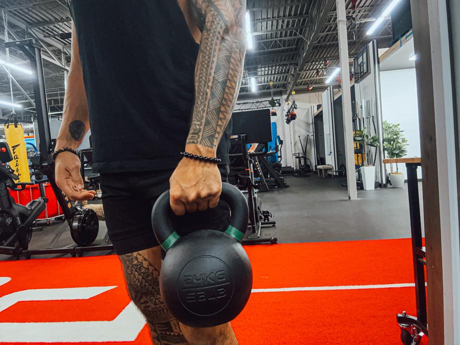 A close look at the Giant v3 24kg Kettlebell in our tester's hand.