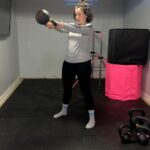Our tester Nicole Davis, CPT, PN1-NC, working out with a Kettlebell Kings Kettlebell.