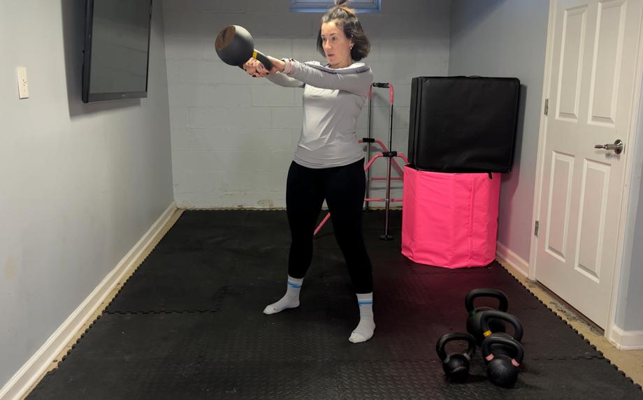 Our tester Nicole Davis, CPT, PN1-NC, working out with a Kettlebell Kings Kettlebell.