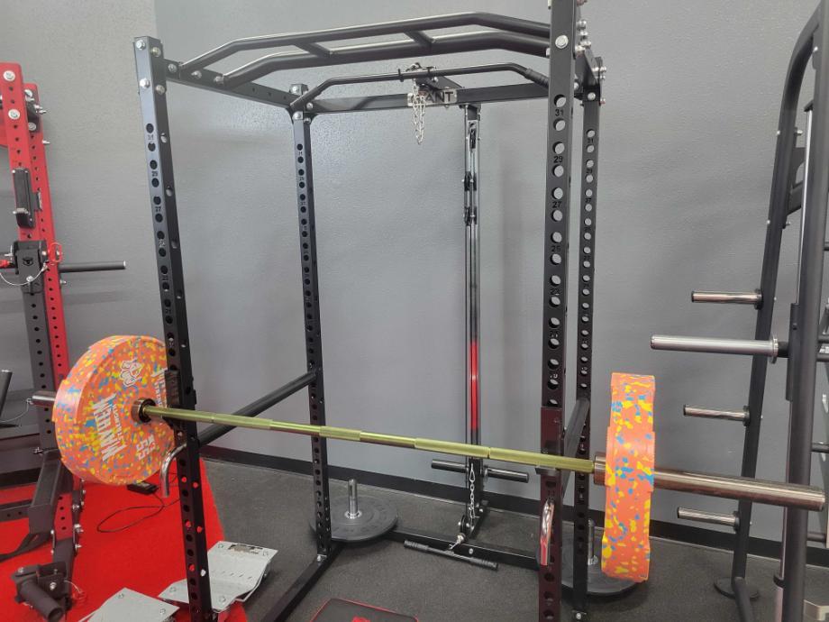 A barbell resting on the Giant Lifting Garage Gym Power 2.0 Rack