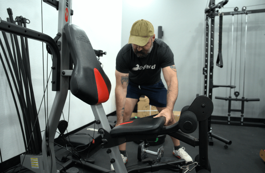 Our tester adjusting the seat of the Bowflex Xtreme 2 SE Home Gym