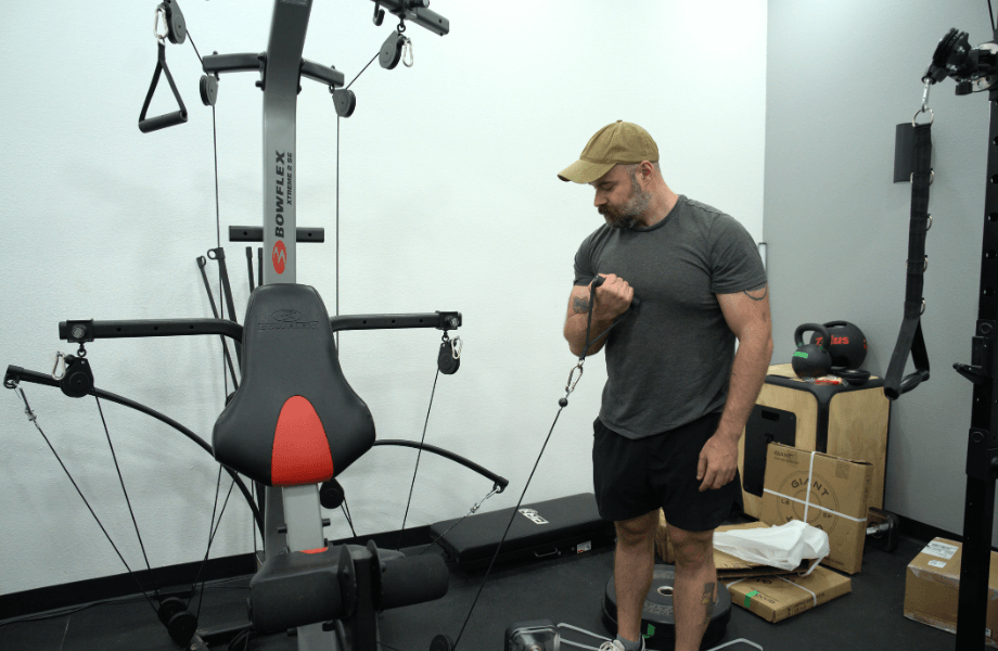 Our tester performing a biceps curl with the Bowflex Xtreme 2 SE Home Gym