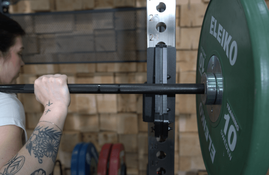 Our tester re-racking their barbell in the Fringe Sport Dane 2.0 functional trainer