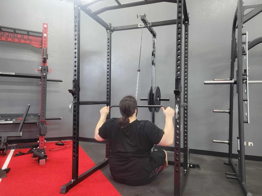 Our tester doing lat pulldowns with the Giant Lifting Garage Gym Power 2.0 Rack