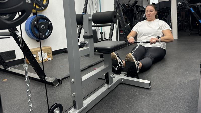 Our tester doing low rows with the GDLF Lat Pulldown Machine