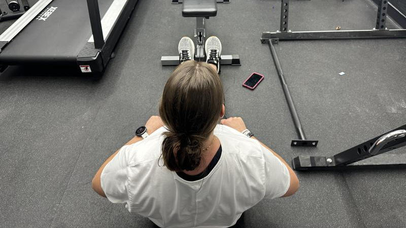 Our tester doing low rows with the GDLF Lat Pulldown Machine