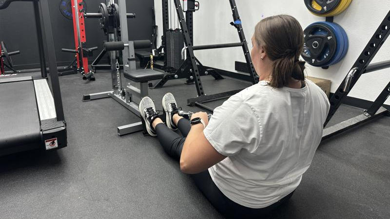 Our tester doing low rows with the GDLF Lat Pulldown Machine