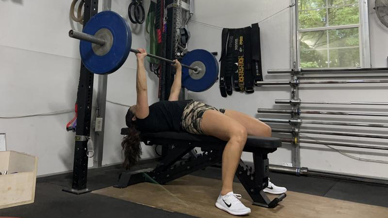 Our tester using the Force USA Pro Series FID Bench