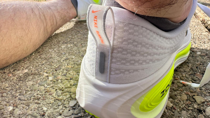 Our tester wearing a pair of Nike Vomero Plus Running Shoes