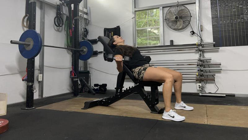 Our tester working out on the Force USA Pro Series FID Bench