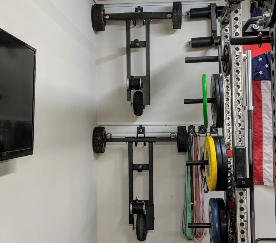 XPO Trainer Sled 2.0 stored in a garage gym
