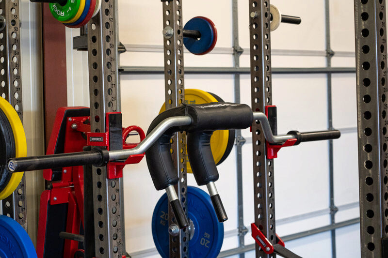 The Marrs-Bar on a squat rack with red J Cups