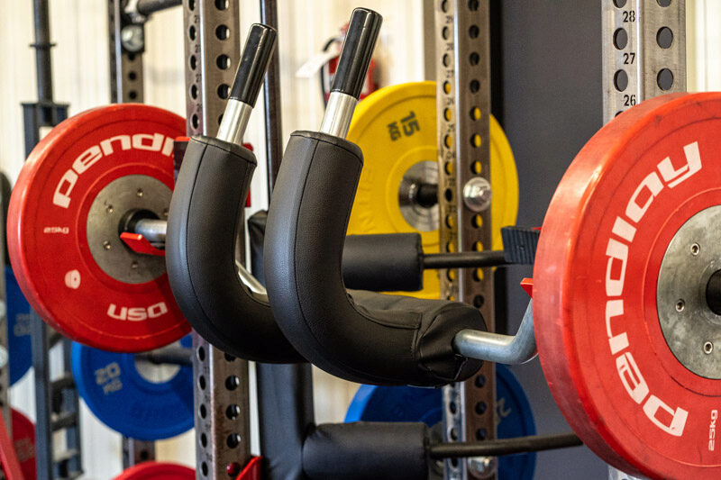 Marrs bar racked on a squat rack