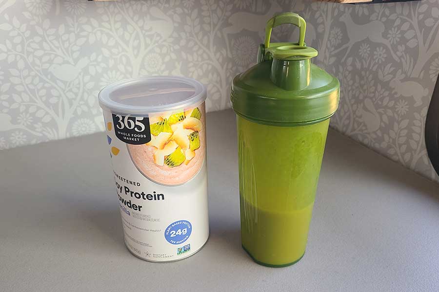 365 soy protein container next to a shaker bottle