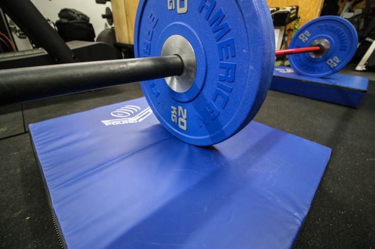 Pound Pad under barbell in a garage gym