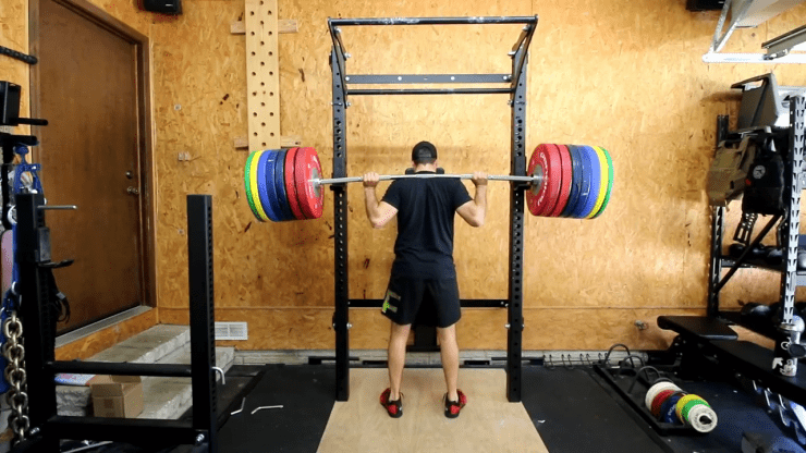 A man working out with the Rogue Ohio Power Bar 