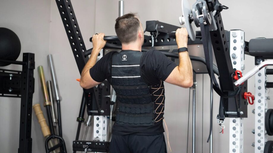 coop performing pull ups with the Hyperwear Hyper Vest Elite Weight Vest