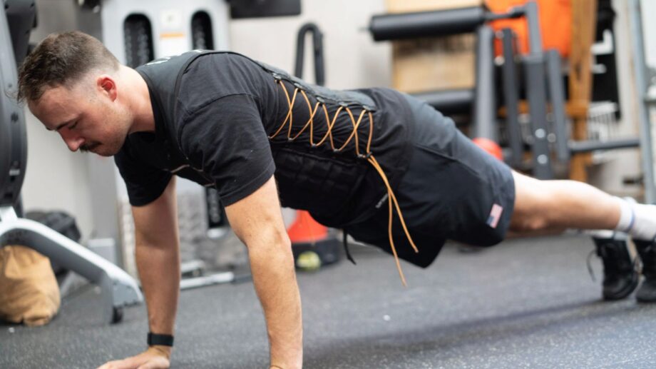 coop performing a hand plank with the Hyperwear Hyper Vest Elite Weight Vest