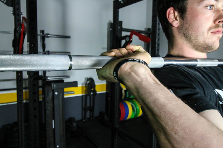 man using the american Barbell Stainless Bearing Bar