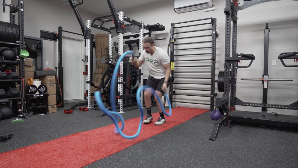 coop using Hyperwear Hyper Rope Battle Rope in a garage gym