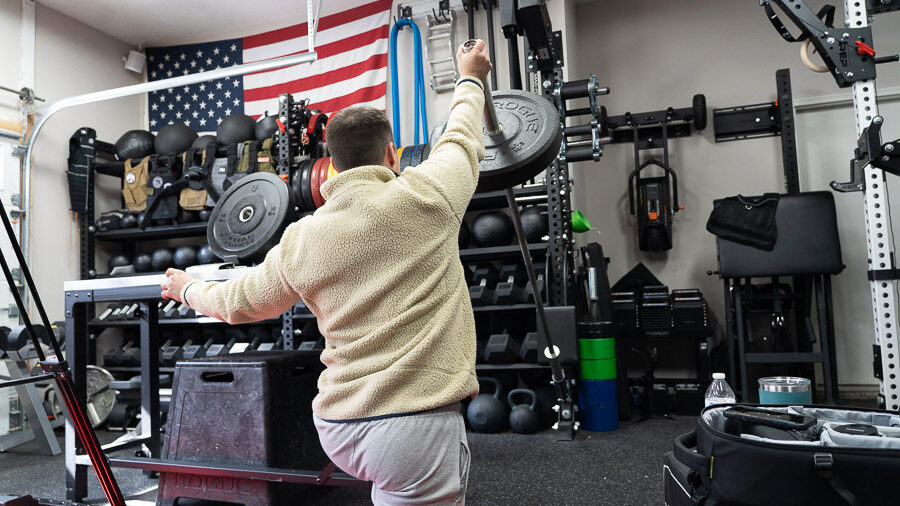 Coop using a Rogue US MIL Spec Bumper Plate for landmines for our Rogue US MIL Spec Bumper Plate review