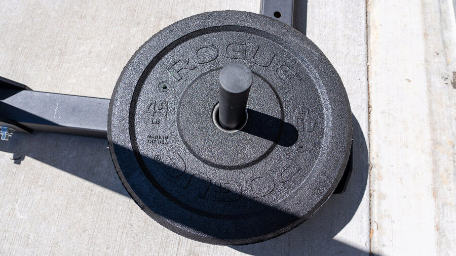 A Rogue US MIL Spec Bumper Plate on a rack outside
