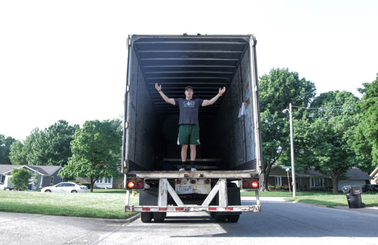 coop unloading the Sorinex Base Camp Squat Rack out of a truck