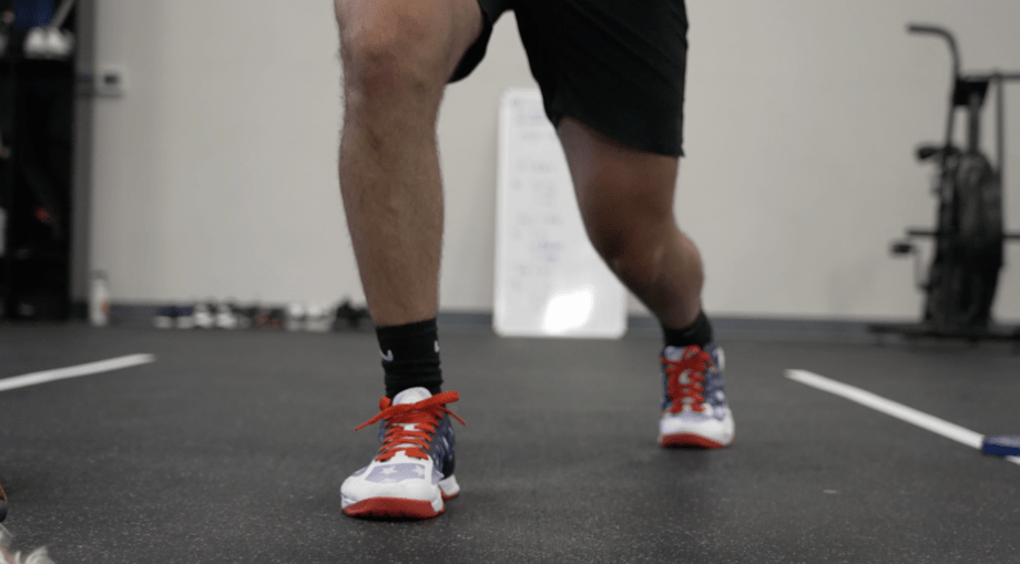 cooping wearing navy and red reebok Indoor Cycling shoes