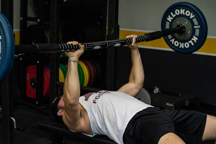 man using the Tsunami Barbell