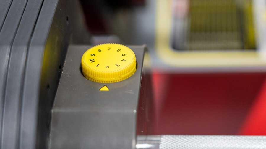 The yellow plastic dial that is used to change the weight. 