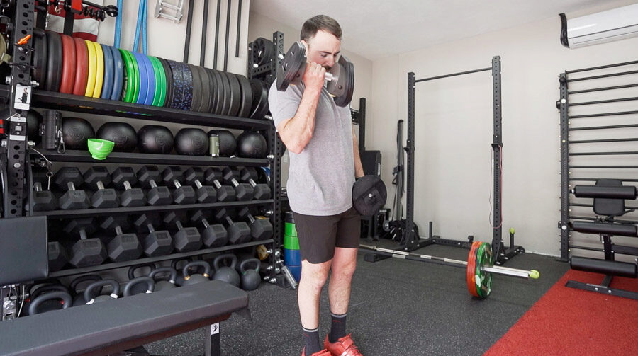 Coop doing a curl with the adjustable dumbbells. 